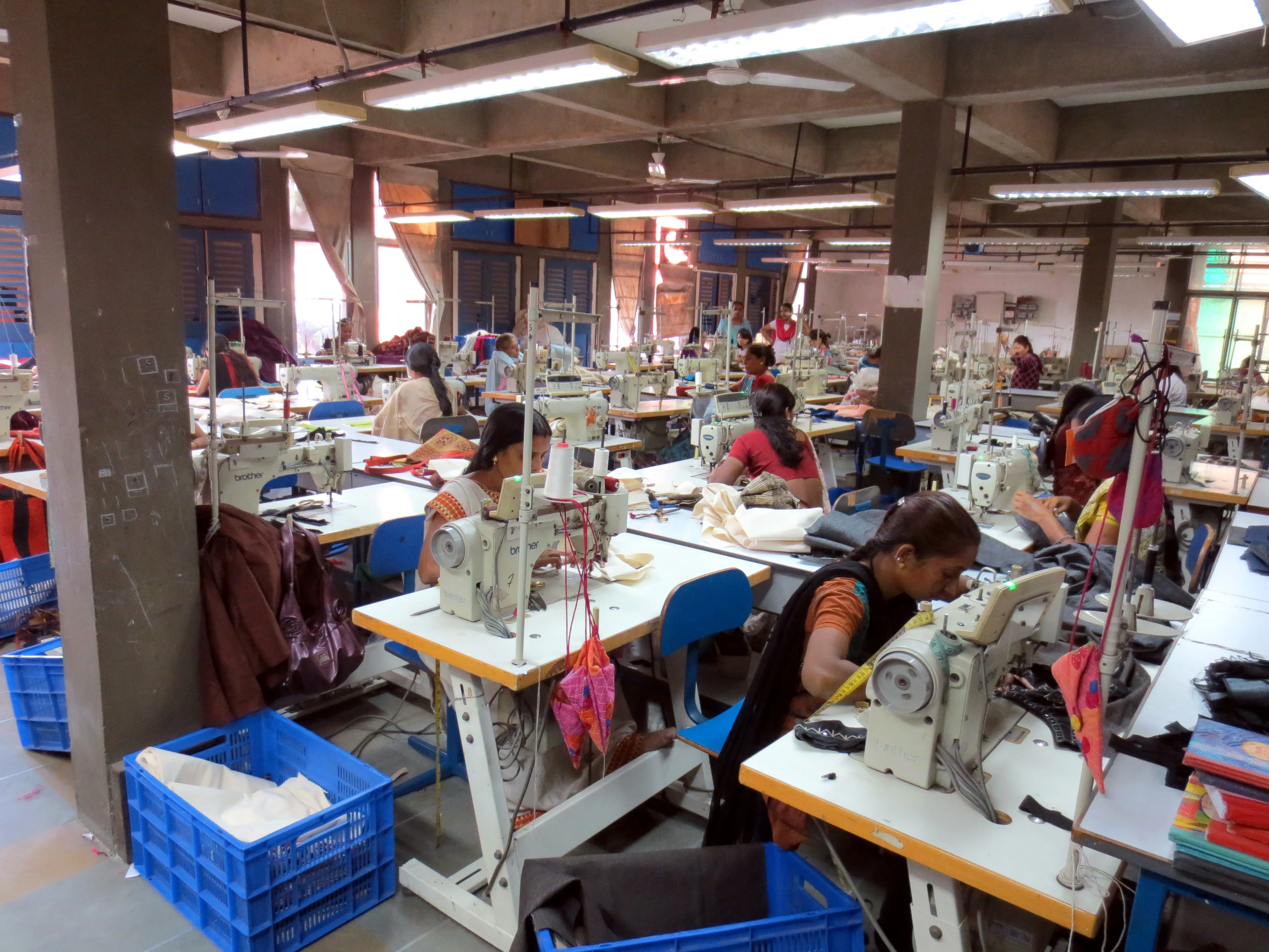 Garment factory workers at sewing machines